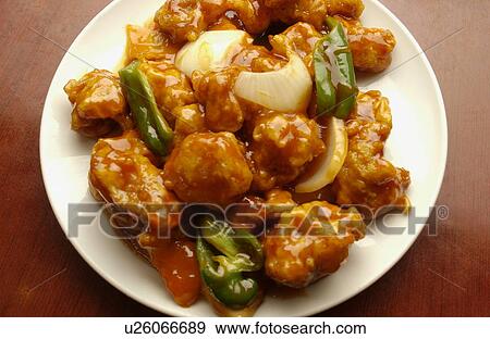 Stock Photo - Plate of sweet and sour pork, close up. Fotosearch
