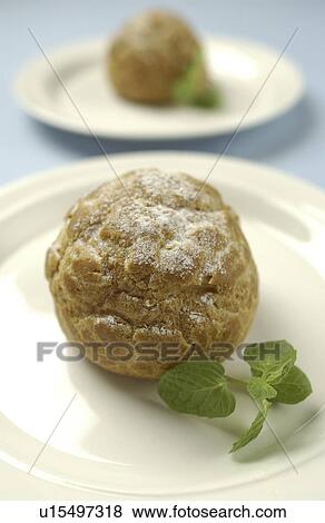 Plates of cream puffs, blue background, differential focus View Large Photo Image Stock Photo - Plates of cream puffs, blue background, differential focus. Fotosearch