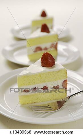 Plates of sliced strawberry cakes, white background View Large Photo Image Stock Photo - Plates of sliced strawberry cakes, white background. Fotosearch