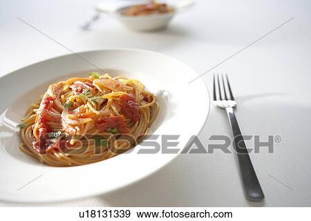 Plates of tomato spaghetti, white background View Large Photo Image Stock Photo - Plates of tomato spaghetti, white background. Fotosearch