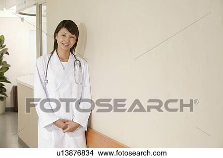 Picture - Portrait of female doctor, smiling. Fotosearch