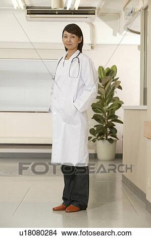 Portrait of female doctor, smiling View Large Photo Image Picture - Portrait of female doctor, smiling. Fotosearch