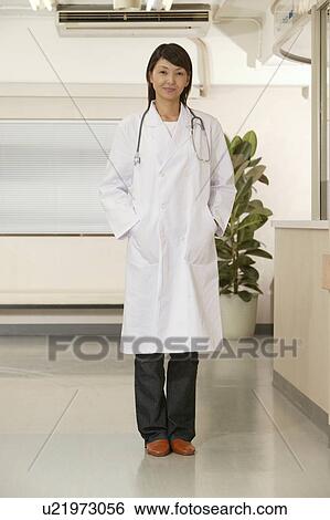 Stock Photograph - Portrait of female doctor, smiling. Fotosearch