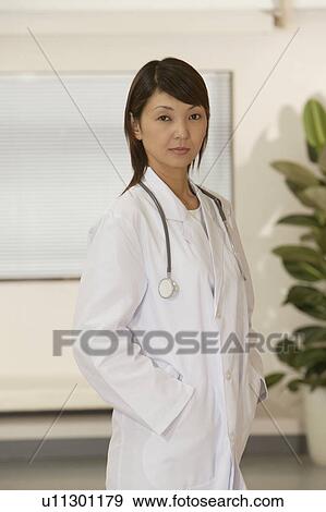 Portrait of female doctor View Large Photo Image Stock Photo - Portrait of female doctor. Fotosearch