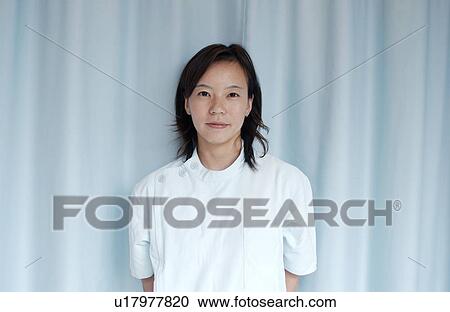 Portrait of female massage therapist, smiling View Large Photo Image Stock Image - Portrait of female massage therapist, smiling. Fotosearch