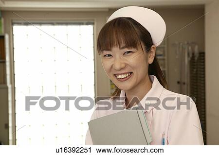 Portrait of female nurse, smiling View Large Photo Image Stock Image - Portrait of female nurse, smiling. Fotosearch