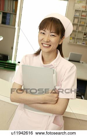 Portrait of female nurse, smiling View Large Photo Image Stock Photograph - Portrait of female nurse, smiling. Fotosearch