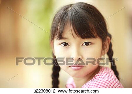 Stock Image - Portrait of girl, close up, differential focus, Awaji city, Hyogo prefecture, Japan. Fotosearch