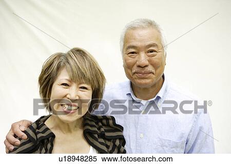 Portrait of mature woman and senior man, smiling, white background View Large Photo Image Stock Photography - Portrait of mature woman and senior man, smiling, white background. Fotosearch