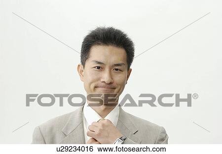 Stock Photograph - Portrait of Mid Adult Man in Business Suit. Fotosearch