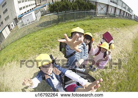 Portrait of school children at riverbank, fish-eye lens View Large Photo Image Picture - Portrait of school children at riverbank, fish-eye lens. Fotosearch