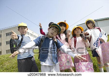 Stock Photo - Portrait of school children at riverbank. Fotosearch