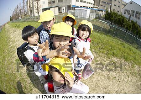 Portrait of school children at riverbank, fish-eye lens View Large Photo Image Stock Photograph - Portrait of school children at riverbank, fish-eye lens. Fotosearch