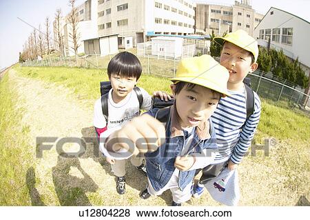 Portrait of schoolboys at riverbank, fish-eye lens View Large Photo Image Stock Photo - Portrait of schoolboys at riverbank, fish-eye lens. Fotosearch