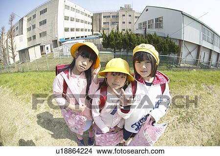 Picture - Portrait of schoolgirls at riverbank, fish-eye lens. Fotosearch