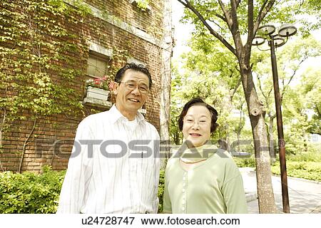 Portrait of senior couple at street View Large Photo Image Stock Photo - Portrait of senior couple at street. Fotosearch