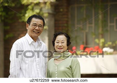 Portrait of senior couple at street View Large Photo Image Stock Photo - Portrait of senior couple at street. Fotosearch
