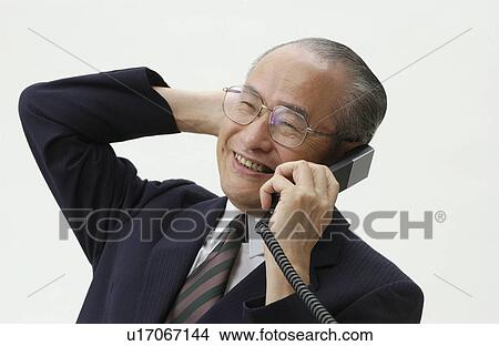 Portrait of Senior Man in Business Suit, Talking on Telephone View Large Photo Image Picture - Portrait of Senior Man in Business Suit, Talking on Telephone. Fotosearch