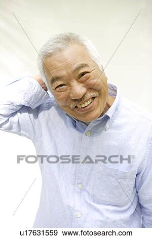 Stock Photo - Portrait of senior man smiling, white background. Fotosearch