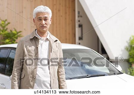 Portrait of senior man standing by car View Large Photo Image Stock Image - Portrait of senior man standing by car. Fotosearch