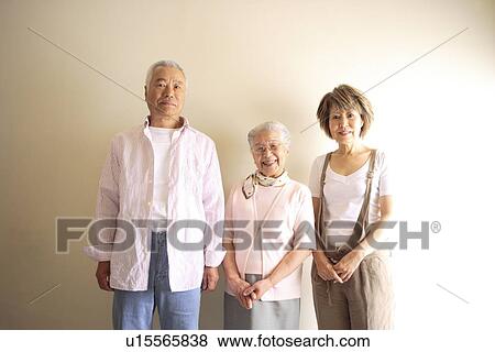 Portrait of two generation family, smiling, white background View Large Photo Image Stock Photo - Portrait of two generation family, smiling, white background. Fotosearch
