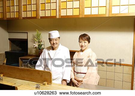 Stock Image - Portrait of woman in Kimono and Japanese chef, smiling, Kyoto city, Kyoto prefecture, Japan. Fotosearch
