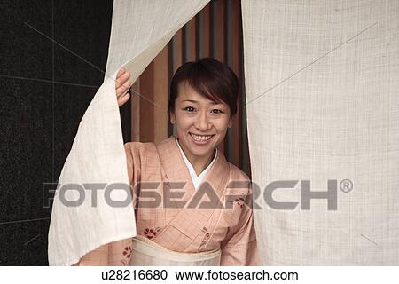 Portrait of woman in Kimono standing in Japanese restaurant entrance, Kyoto city, Kyoto prefecture, Japan View Large Photo Image Stock Image - Portrait of woman in Kimono standing in Japanese restaurant entrance, Kyoto city, Kyoto prefecture, Japan. Fotosearch