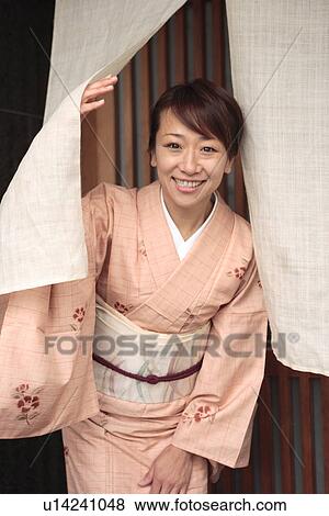 Portrait of woman in Kimono standing in Japanese restaurant entrance, Kyoto city, Kyoto prefecture, Japan View Large Photo Image Stock Photo - Portrait of woman in Kimono standing in Japanese restaurant entrance, Kyoto city, Kyoto prefecture, Japan. Fotosearch