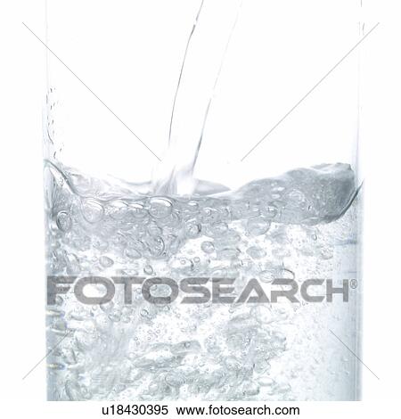 Stock Photography - Pouring Carbonated Water into Glass. Fotosearch