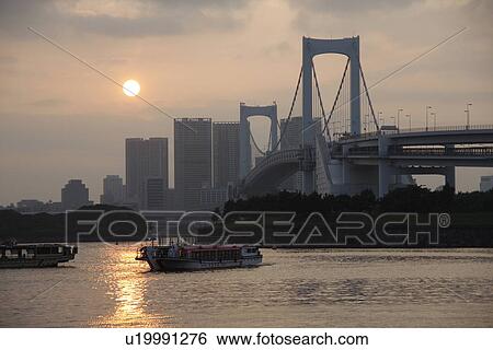Stock Photograph - Rainbow Bridge in the evening, Tokyo prefecture, Japan. Fotosearch
