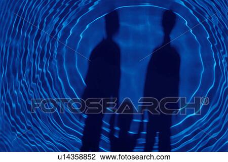 Stock Image - Rippled water and shadow of family. Fotosearch
