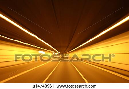 Stock Image - Road tunnel, blurred motion, long exposure. Fotosearch