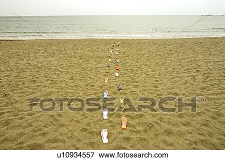Sandals placed in lines on beach, Kamakura city, Kanagawa prefecture, Japan View Large Photo Image Stock Photo - Sandals placed in lines on beach, Kamakura city, Kanagawa prefecture, Japan. Fotosearch