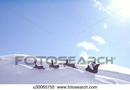 Santa and reindeer decoration in snow View Large Photo Image Stock Photography - Santa and reindeer decoration in snow. Fotosearch