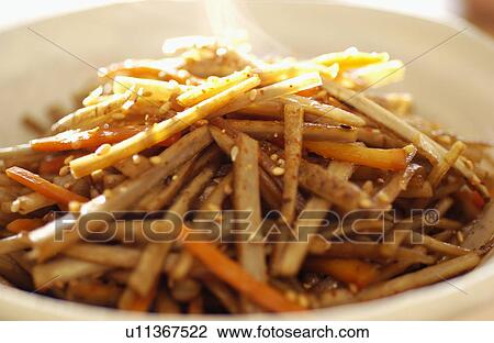 Stock Image - Saut? ©ed burdock root and carrots. Fotosearch
