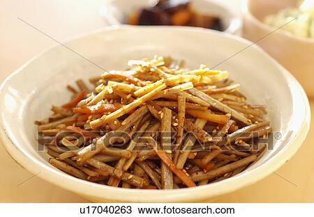Stock Image - Saut? ©ed burdock root and carrots. Fotosearch