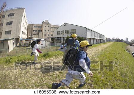 Schoolboys running on riverbank, fish-eye lens View Large Photo Image Stock Photograph - Schoolboys running on riverbank, fish-eye lens. Fotosearch