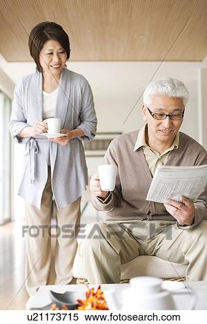 Stock Photography - Senior couple drinking coffee. Fotosearch