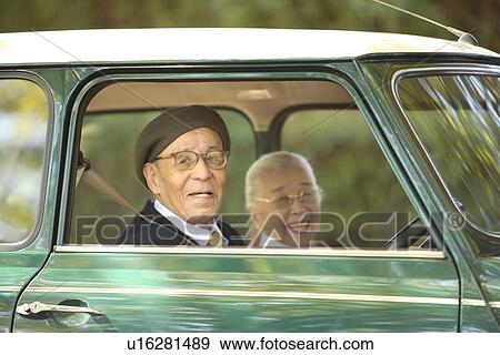 Stock Photo - Senior couple driving a car. Fotosearch