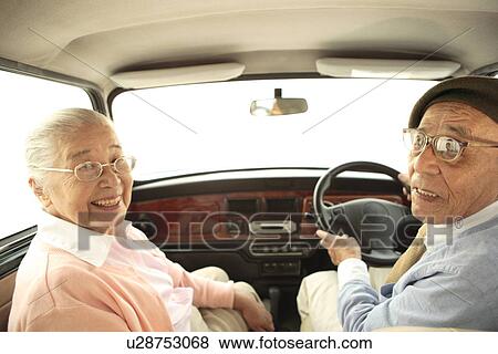 Stock Photo - Senior couple driving a car. Fotosearch