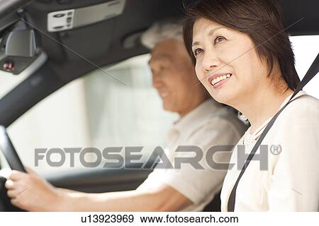 Senior couple in car, smiling View Large Photo Image Stock Photo - Senior couple in car, smiling. Fotosearch