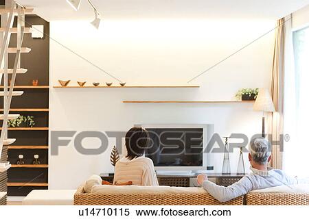 Senior couple watching TV View Large Photo Image Stock Photography - Senior couple watching TV. Fotosearch