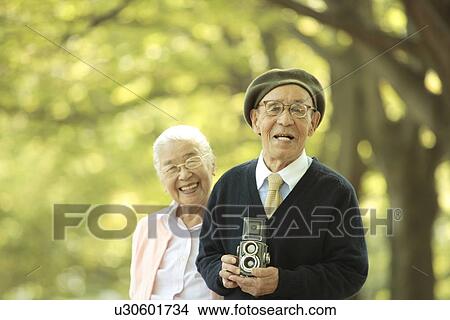 Senior couple with vintage camera View Large Photo Image Picture - Senior couple with vintage camera. Fotosearch