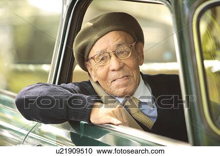 Stock Image - Senior man driving a car. Fotosearch