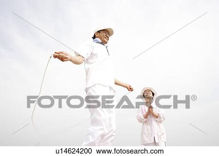 Stock Image - Senior man jumping rope. Fotosearch