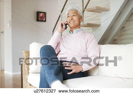 Stock Photo - Senior man on cell phone. Fotosearch