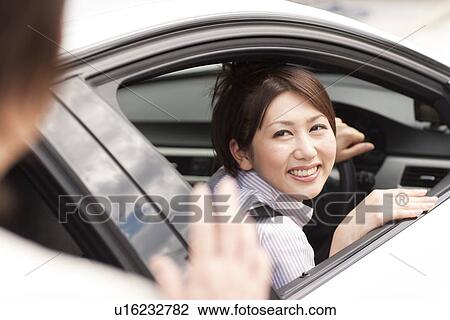 Senior woman talking to her daughter in car, smiling View Large Photo Image Stock Image - Senior woman talking to her daughter in car, smiling. Fotosearch