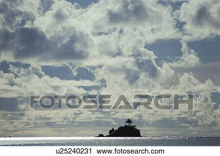 Stock Image - Silhouette of Island Stands in Sea. Fotosearch