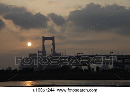Picture - Silhouette of Rainbow Bridge in the evening, Tokyo prefecture, Japan. Fotosearch