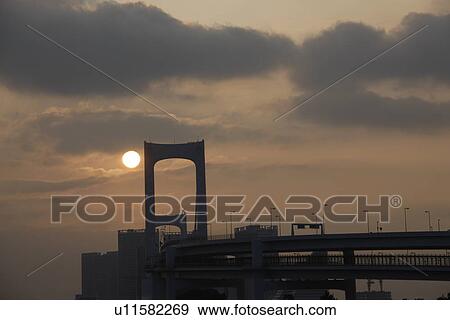 Stock Photo - Silhouette of Rainbow Bridge in the evening, Tokyo prefecture, Japan. Fotosearch